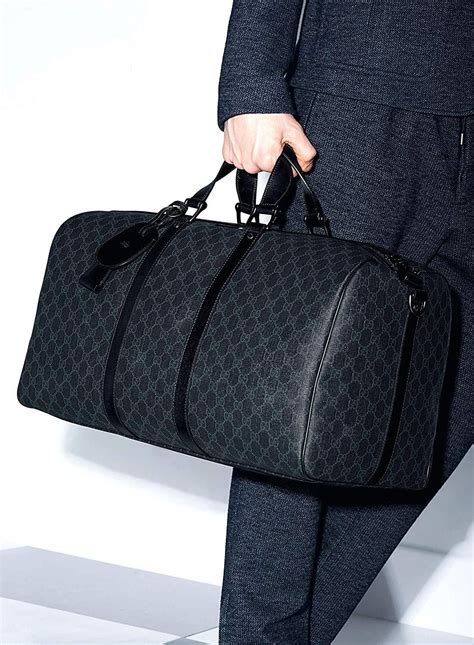 mens gucci travel bag|Gucci duffle bag with wheels.